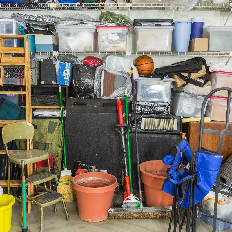 a messy garage filled with various items