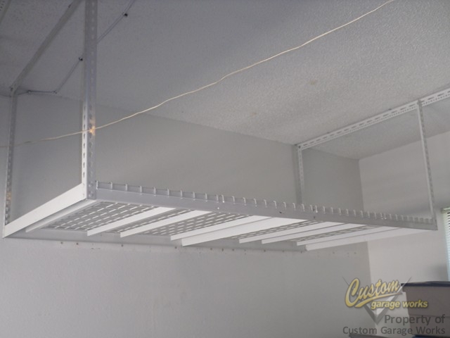 Garage Storage Can Be Done With Overhead Hanging Shelves